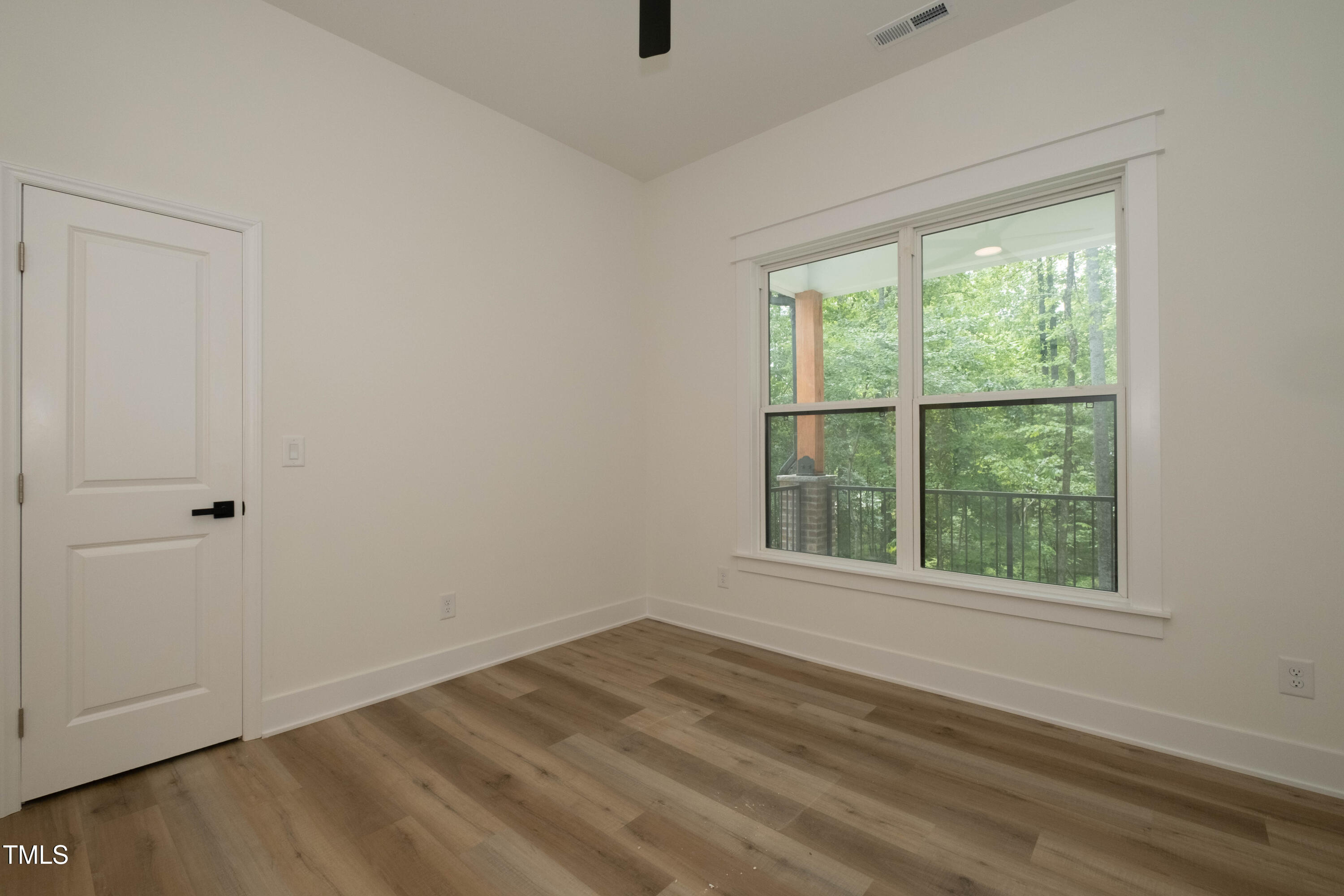 690 Oaks Lane Road Timberlake, NC 27583 - Photo 6 of 31 an empty room with a window