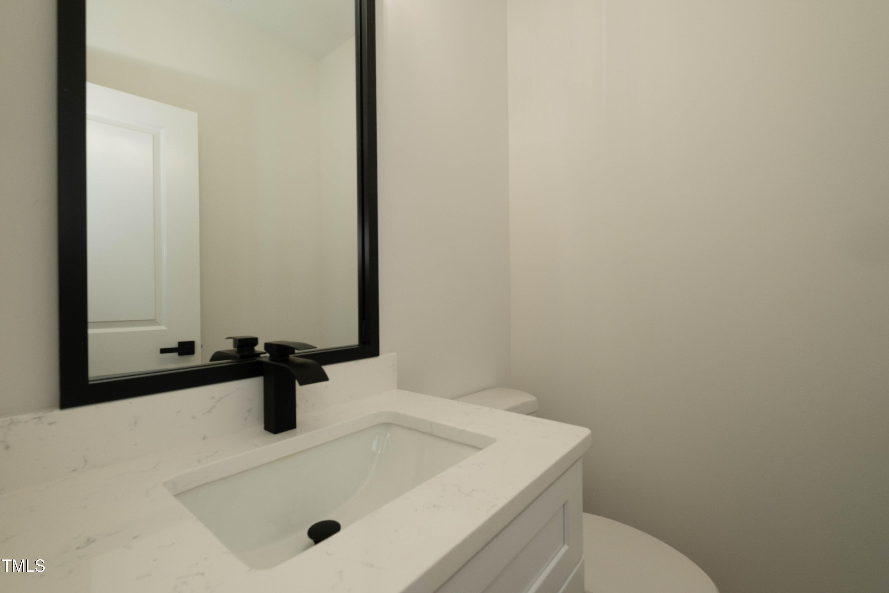 690 Oaks Lane Road Timberlake, NC 27583 - Photo 10 of 31 a bathroom with a sink and a mirror