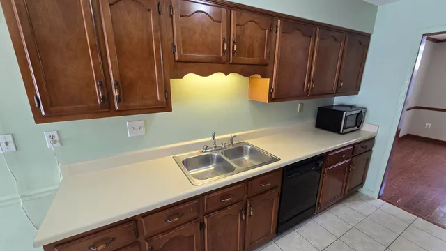 a kitchen with a sink and cabinets