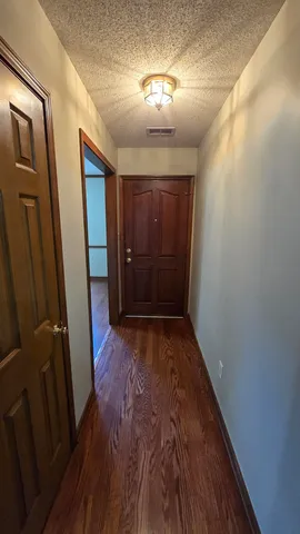 a view of gallery with wooden floor