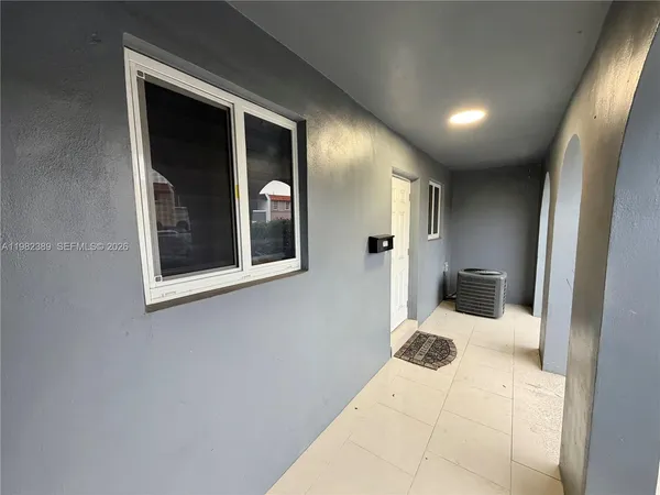 a view of a hallway with a bedroom