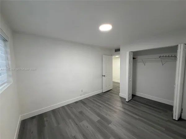 a view of a hallway with stairs and a hallway