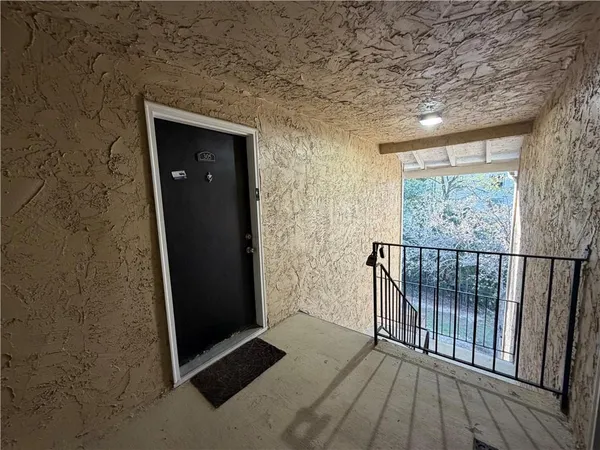 a view of entryway with wooden floor