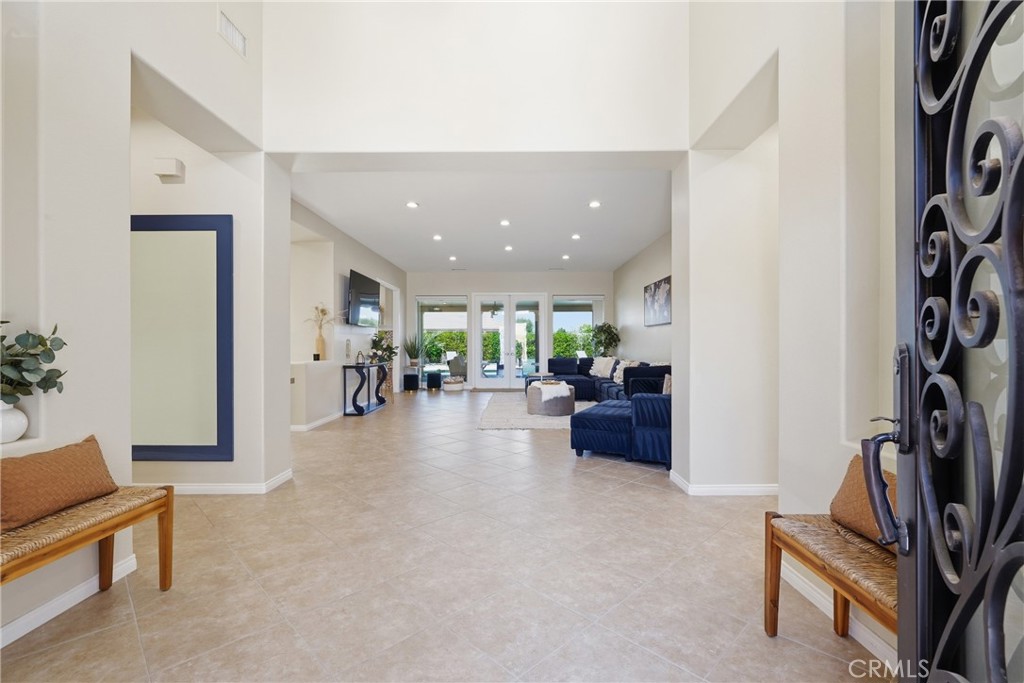 9 Orleans Road Rancho Mirage, CA 92270 - Photo 13 of 71 a living room with furniture and a flat screen tv