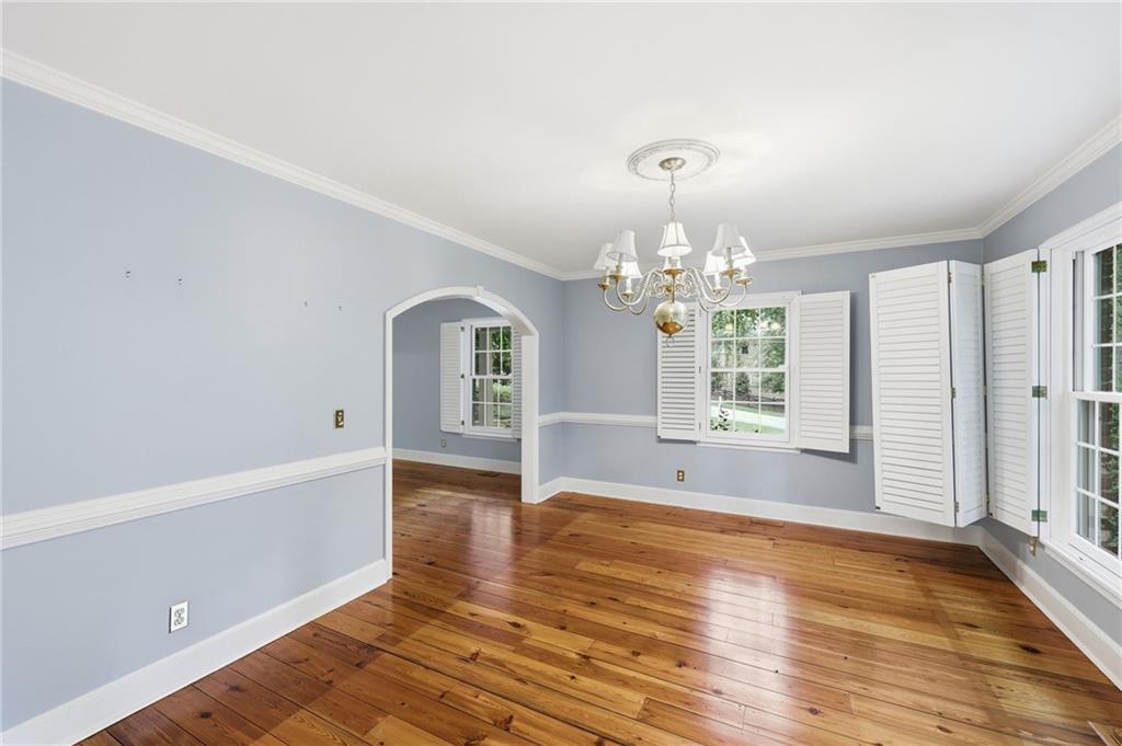 1281 Springdale Road Gainesville, GA 30501 - Photo 31 of 91 a view of an empty room with window and wooden floor