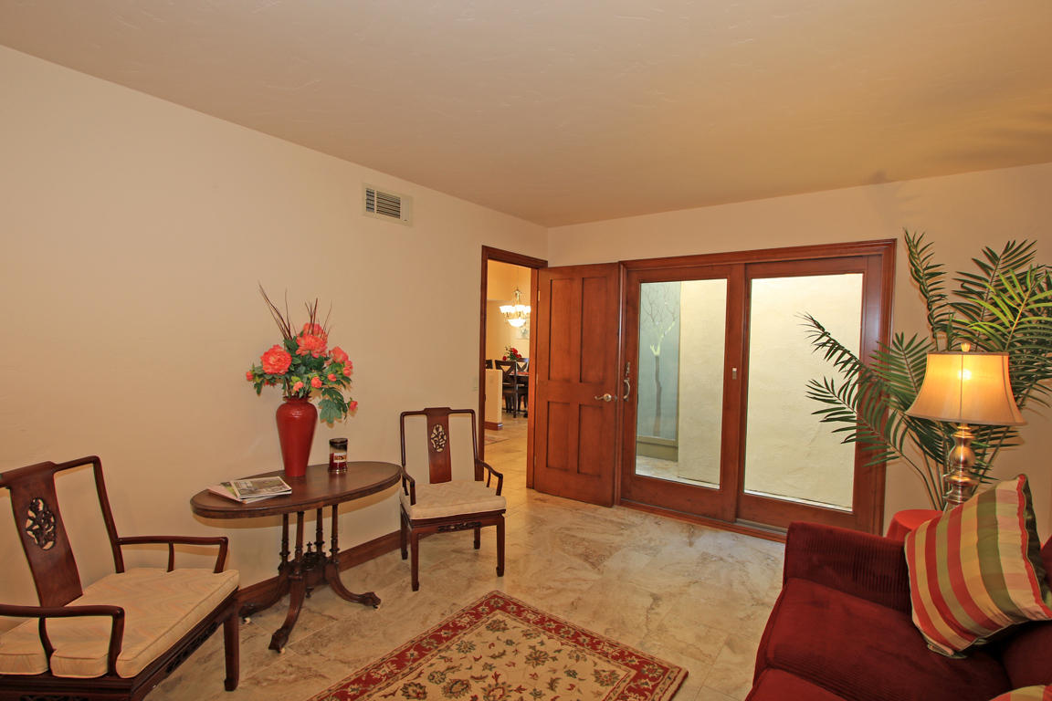 210 Wagon Wheel Road Palm Desert, CA 92211 - Photo 19 of 27 a living room with furniture and a potted plant