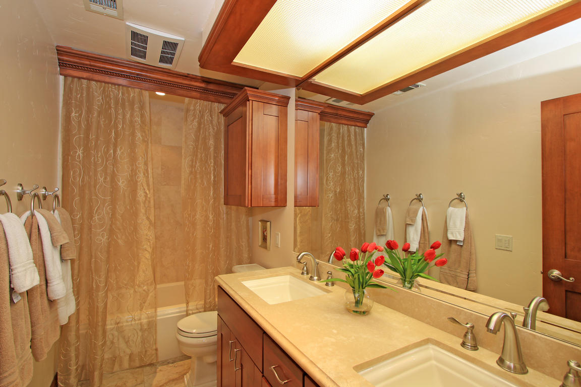 210 Wagon Wheel Road Palm Desert, CA 92211 - Photo 22 of 27 a bathroom with a sink vanity and a mirror