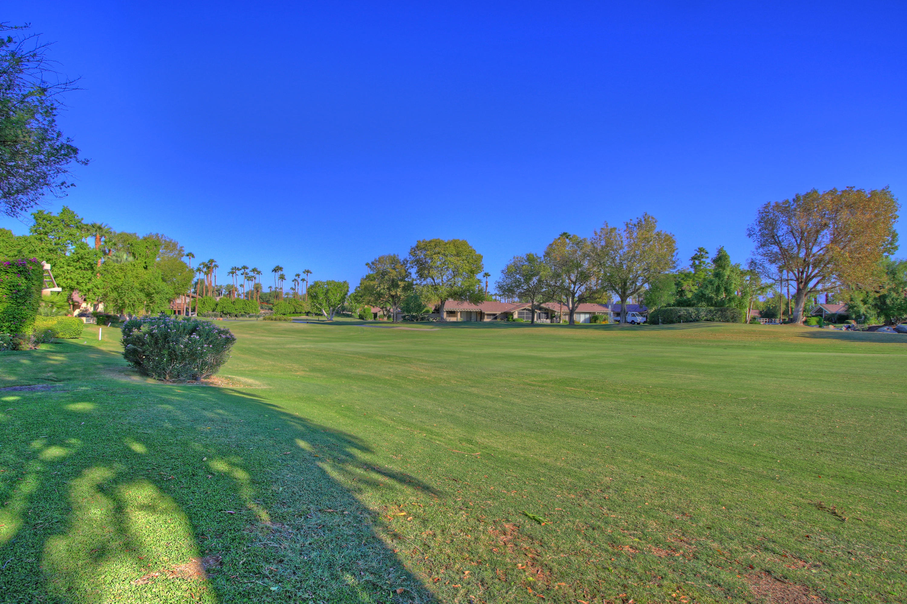210 Wagon Wheel Road Palm Desert, CA 92211 - Photo 24 of 27 a view of building with outdoor space and trees all around