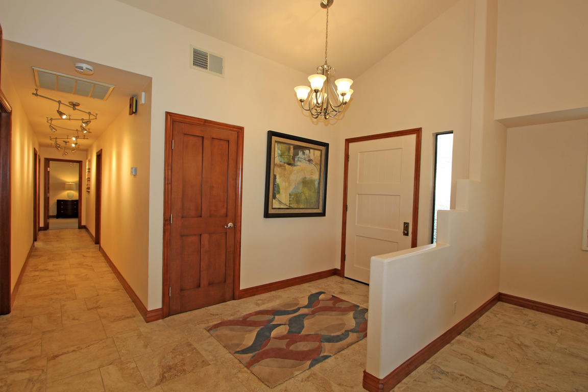 210 Wagon Wheel Road Palm Desert, CA 92211 - Photo 5 of 27 a view of a chandelier fan and wooden floor
