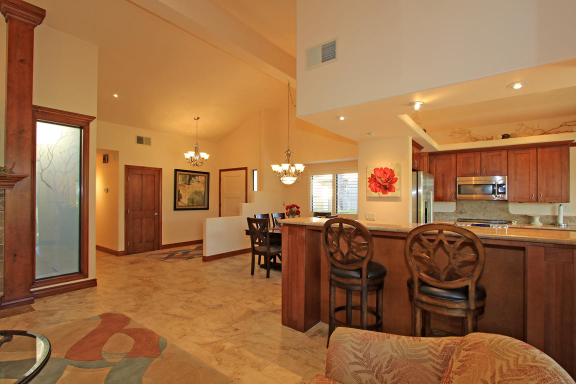 210 Wagon Wheel Road Palm Desert, CA 92211 - Photo 9 of 27 a living room with lots of furniture and appliances