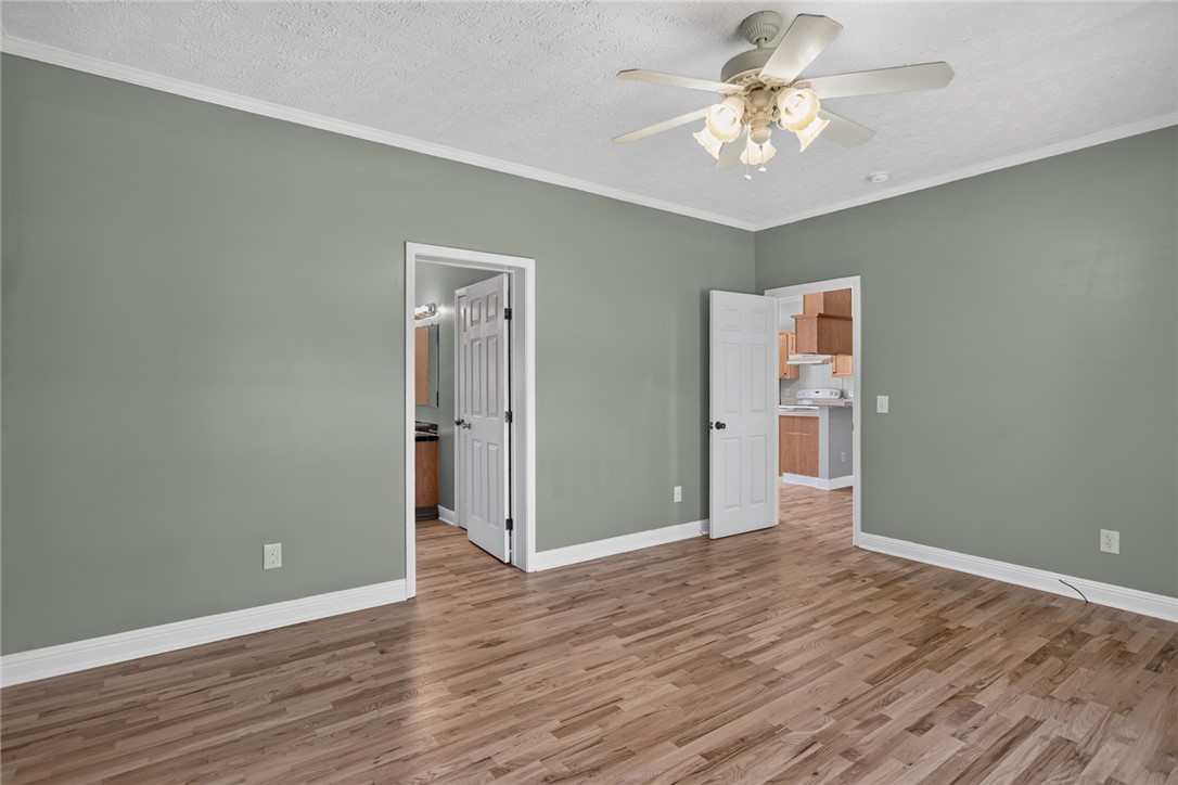 564 Fairfield Road Walhalla, SC 29691 - Photo 18 of 50 Rich wood floors and clean crown molding enhance this versatile living space.