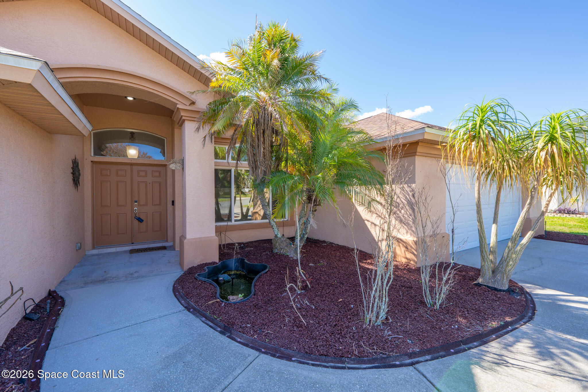 1697 Atrium Drive Melbourne, FL 32935 - Photo 2 of 42 Front Patio