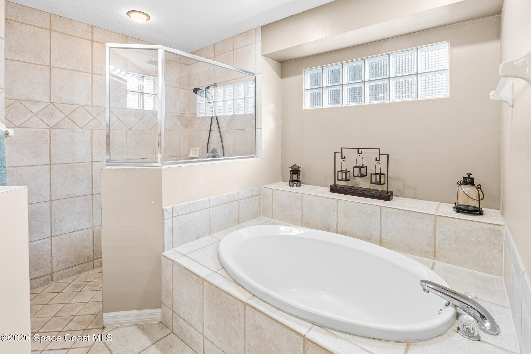1697 Atrium Drive Melbourne, FL 32935 - Photo 23 of 42 Jetted Tub & Walk-In Tiled Shower