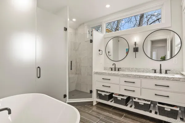 a bathroom with a double vanity sink and a mirror