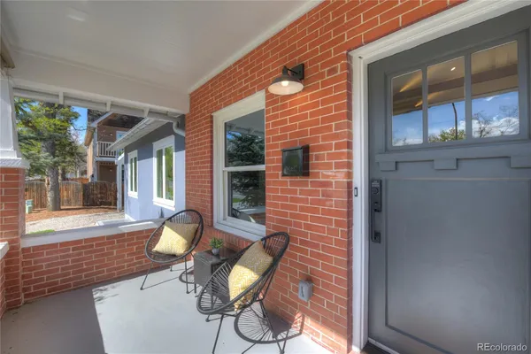 a view of house with outdoor seating space