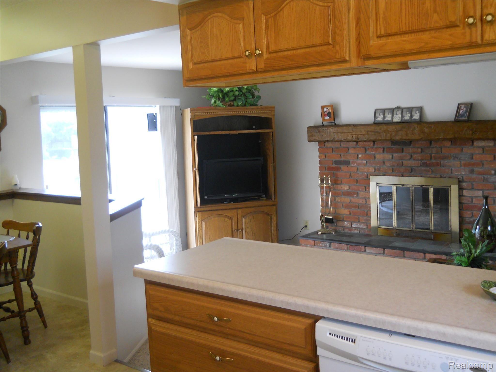 3801 Harvey Lake Road Highland, MI 48356 - Photo 9 of 33 kitchen & dining w/pass-thru to family room