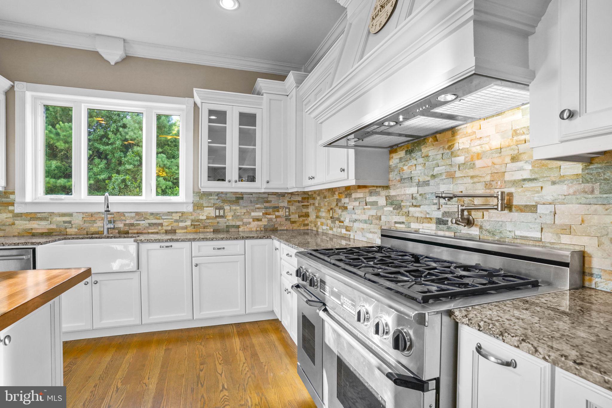 23135 Grampton Road Clements, MD 20624 - Photo 17 of 50 a kitchen with a stove a sink and a window