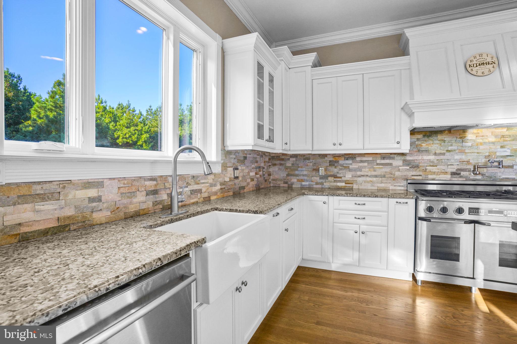23135 Grampton Road Clements, MD 20624 - Photo 19 of 50 a kitchen with a sink stove and cabinets
