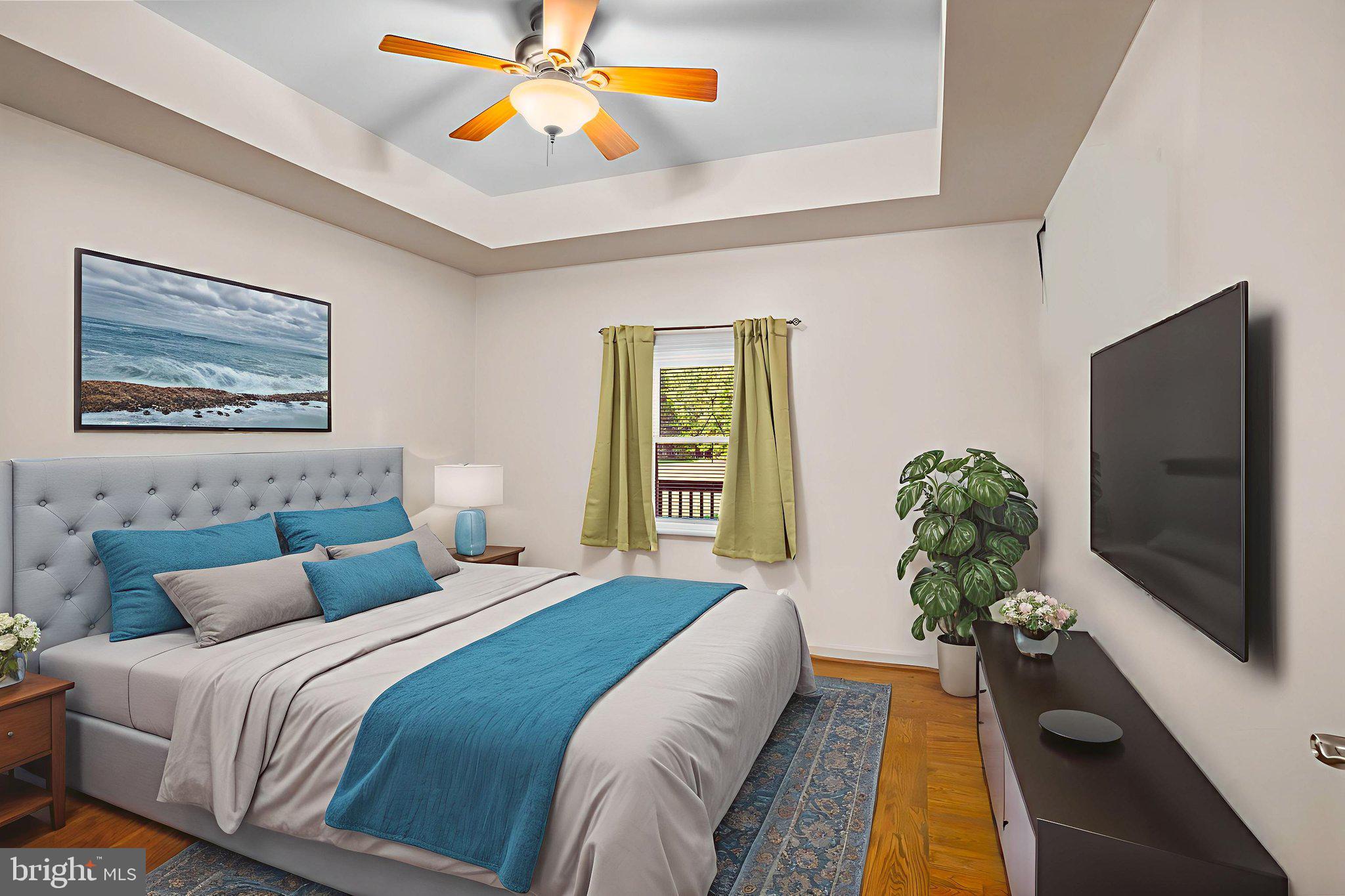 23135 Grampton Road Clements, MD 20624 - Photo 24 of 50 a bedroom with a bed and a chandelier