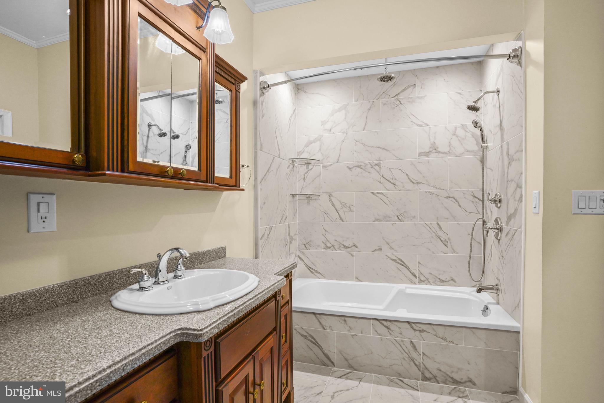 23135 Grampton Road Clements, MD 20624 - Photo 26 of 50 a bathroom with a granite countertop sink and a bathtub