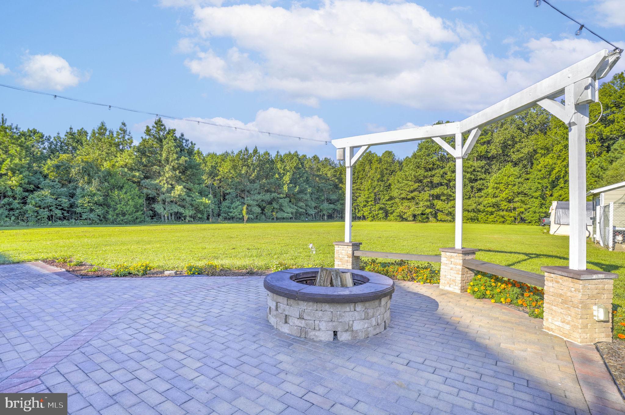 23135 Grampton Road Clements, MD 20624 - Photo 41 of 50 a view of a swimming pool and a yard