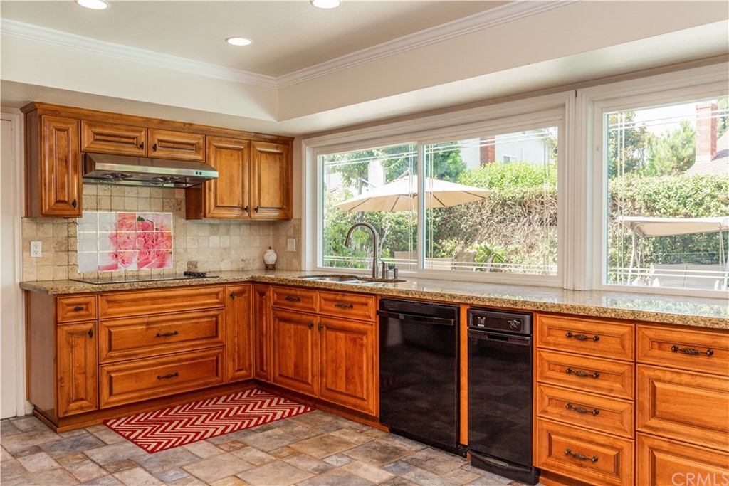 331 Bagnall Avenue Placentia, CA 92870 - Photo 14 of 37 a kitchen with a sink stove and cabinets