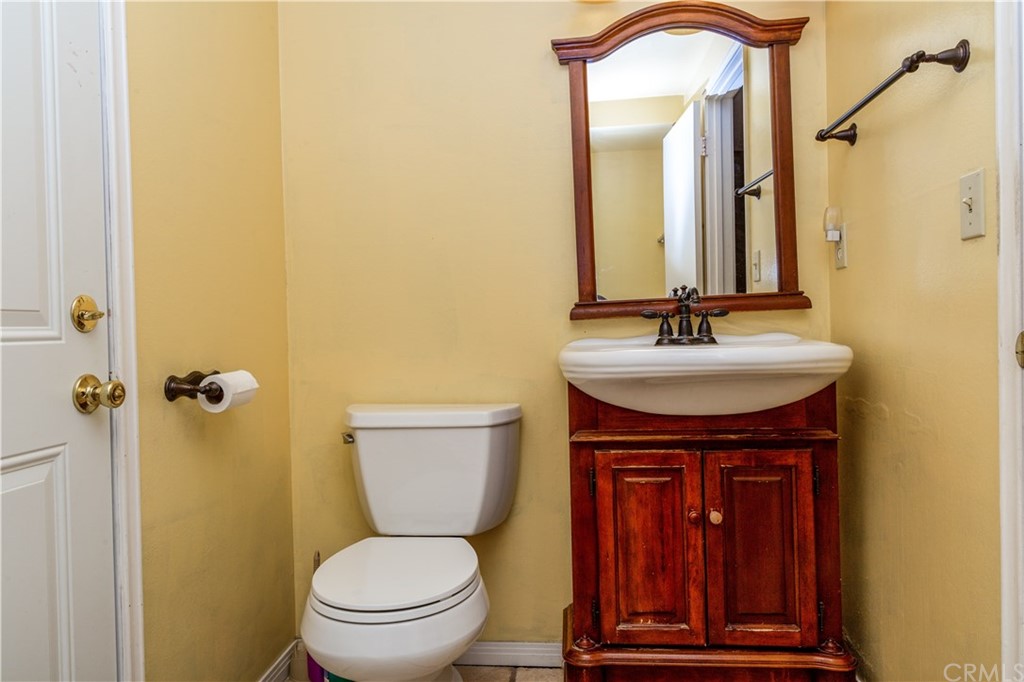 331 Bagnall Avenue Placentia, CA 92870 - Photo 19 of 37 a bathroom with a toilet sink and mirror
