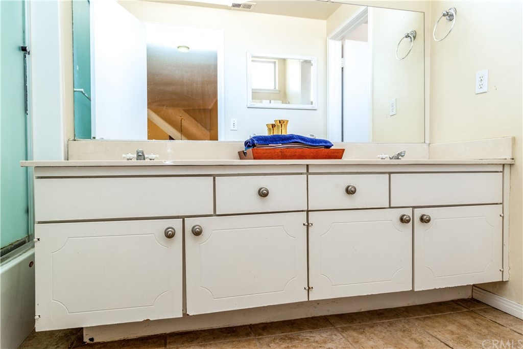 331 Bagnall Avenue Placentia, CA 92870 - Photo 23 of 37 a bathroom with a sink and a mirror