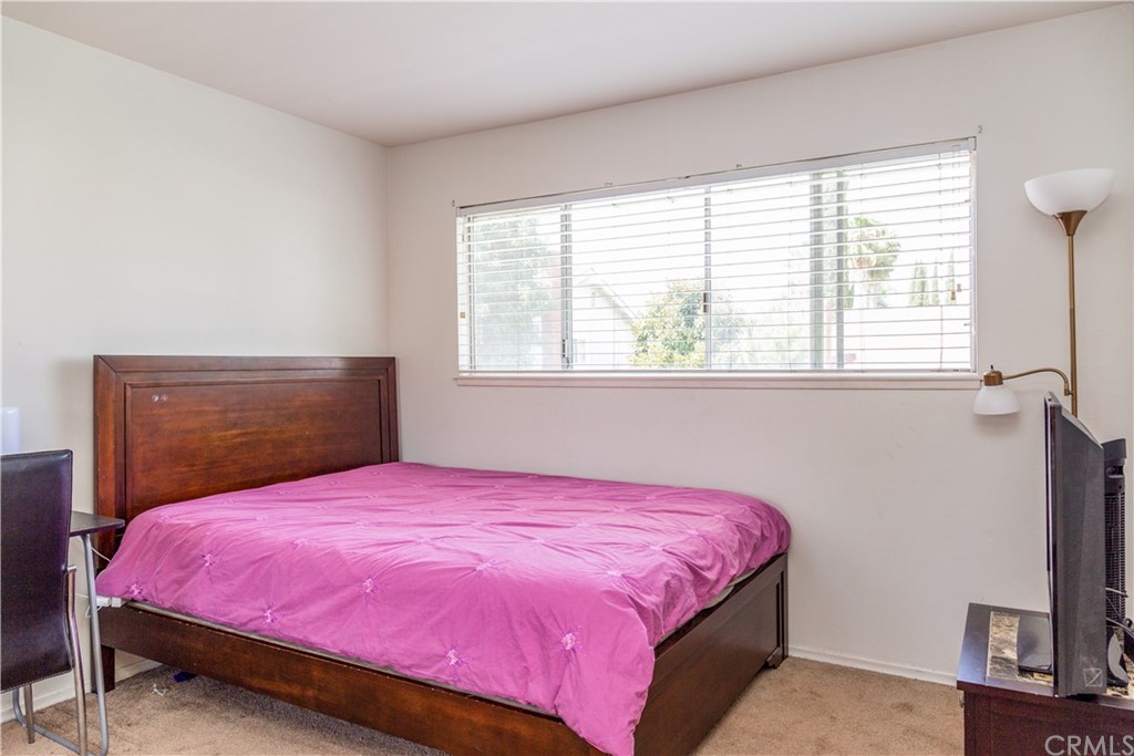 331 Bagnall Avenue Placentia, CA 92870 - Photo 25 of 37 a bedroom with a bed and a flat tv screen on dresser