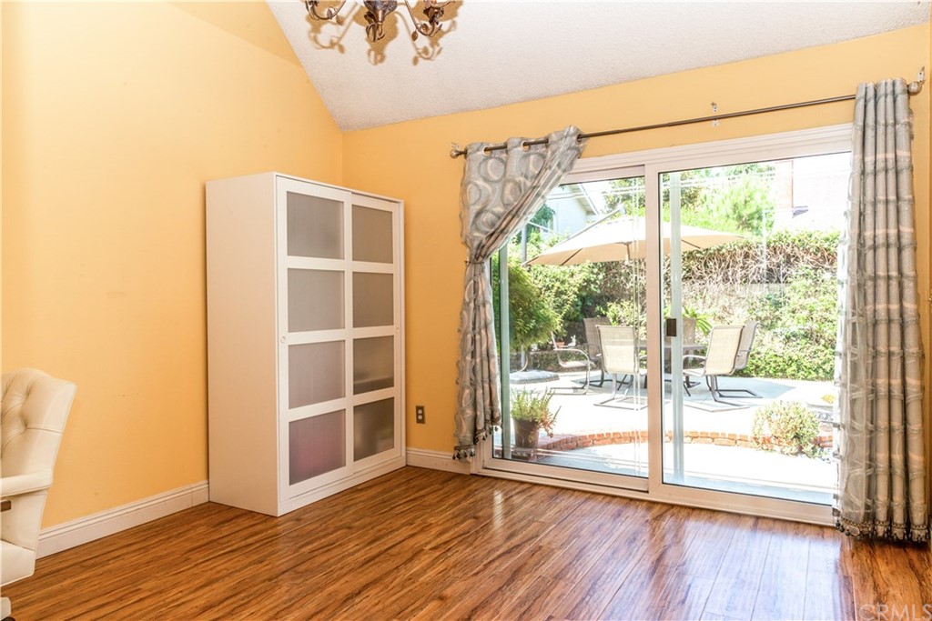 331 Bagnall Avenue Placentia, CA 92870 - Photo 10 of 37 a view of an empty room with wooden floor and a window