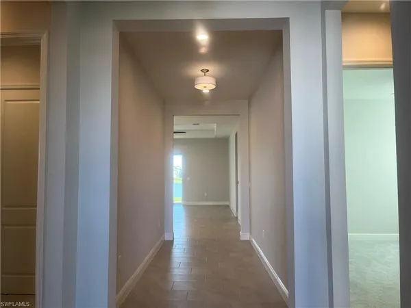 a view of hallway with livingroom