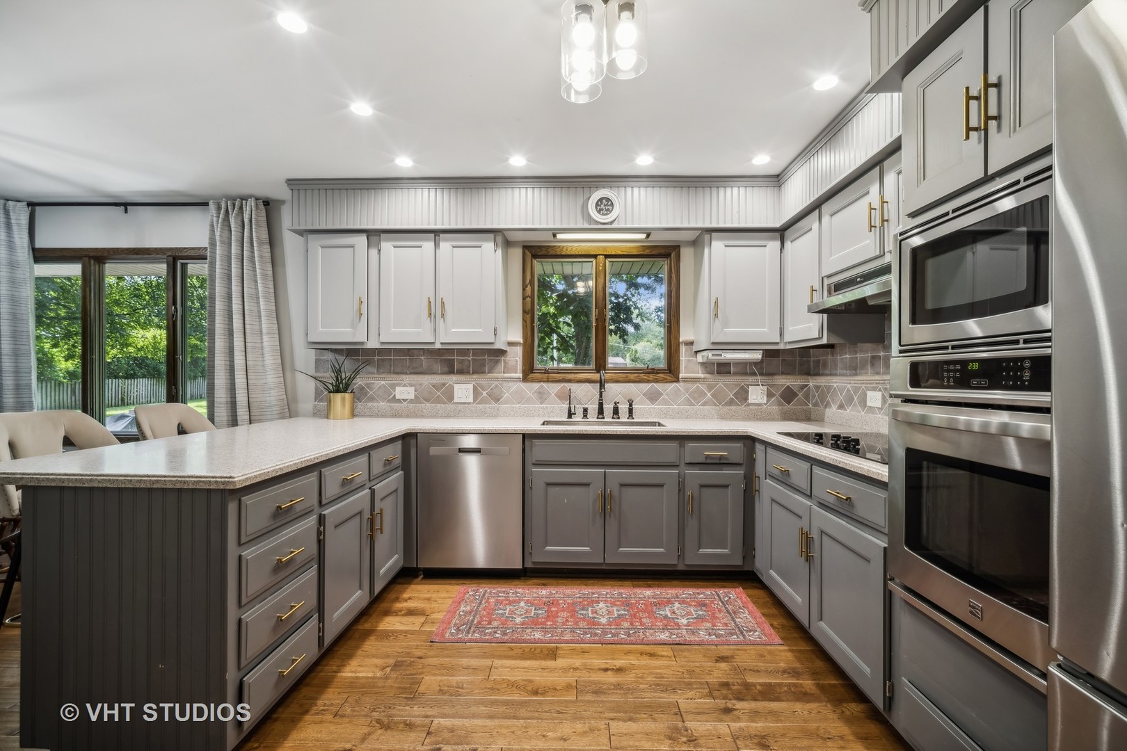 4N600 Klein Road West Chicago, IL 60185 - Photo 6 of 23 a kitchen with stainless steel appliances granite countertop a sink and stove top oven