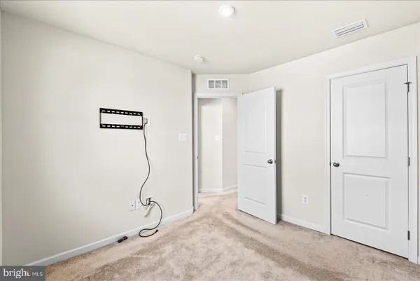 a room with gym equipment and a window