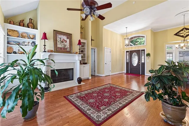 a kitchen with stainless steel appliances granite countertop a stove a refrigerator and a microwave