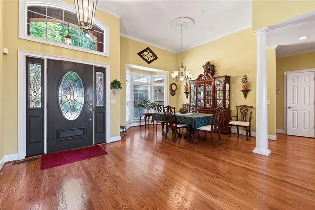 a kitchen with stainless steel appliances granite countertop wooden cabinets a sink and a window