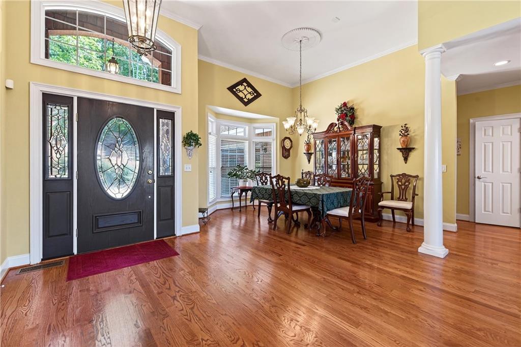 865 Laurel Ridge Road Cleveland, GA 30528 - Photo 15 of 81 a view of a dining room with furniture window and wooden floor