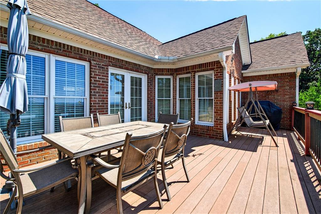 865 Laurel Ridge Road Cleveland, GA 30528 - Photo 19 of 81 a view of a patio with a table and chairs