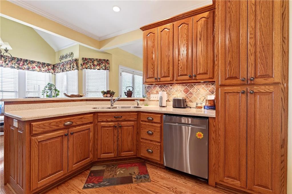 865 Laurel Ridge Road Cleveland, GA 30528 - Photo 23 of 81 a kitchen with stainless steel appliances granite countertop wooden cabinets a sink and a window