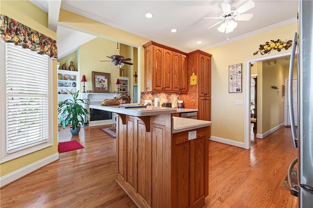 865 Laurel Ridge Road Cleveland, GA 30528 - Photo 24 of 81 a living room with stainless steel appliances kitchen island granite countertop furniture and a chandelier