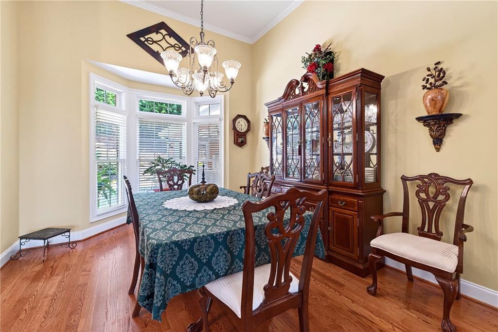 865 Laurel Ridge Road Cleveland, GA 30528 - Photo 26 of 81 a view of a dining room with furniture window and wooden floor