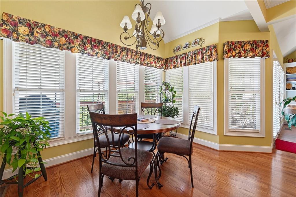 865 Laurel Ridge Road Cleveland, GA 30528 - Photo 28 of 81 a view of a dining room with furniture and wooden floor