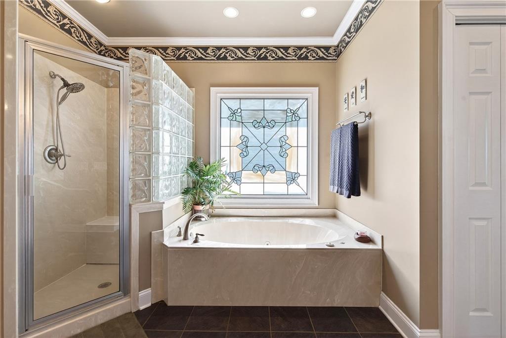 865 Laurel Ridge Road Cleveland, GA 30528 - Photo 31 of 81 a bathroom with a bathtub and a shower