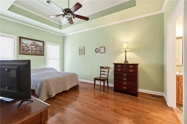 a living room with furniture a fireplace and a large window