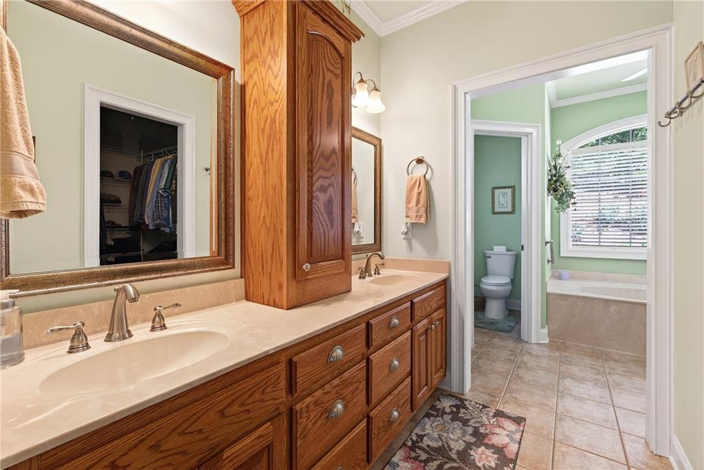 865 Laurel Ridge Road Cleveland, GA 30528 - Photo 38 of 81 a bathroom with double vanity sinks and a mirror