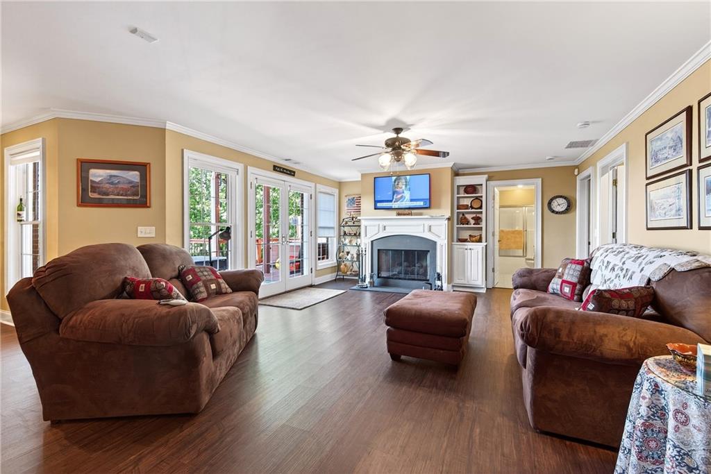 865 Laurel Ridge Road Cleveland, GA 30528 - Photo 46 of 81 a living room with furniture a fireplace and a chandelier