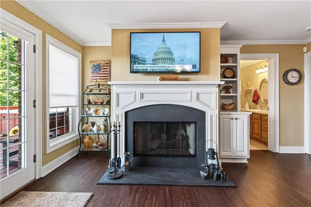 a aerial view of a house with a yard table and chairs