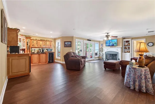 an aerial view of residential house with outdoor space and trees all around