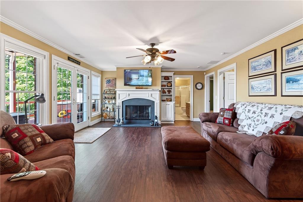 865 Laurel Ridge Road Cleveland, GA 30528 - Photo 51 of 81 a living room with furniture a fireplace and a large window