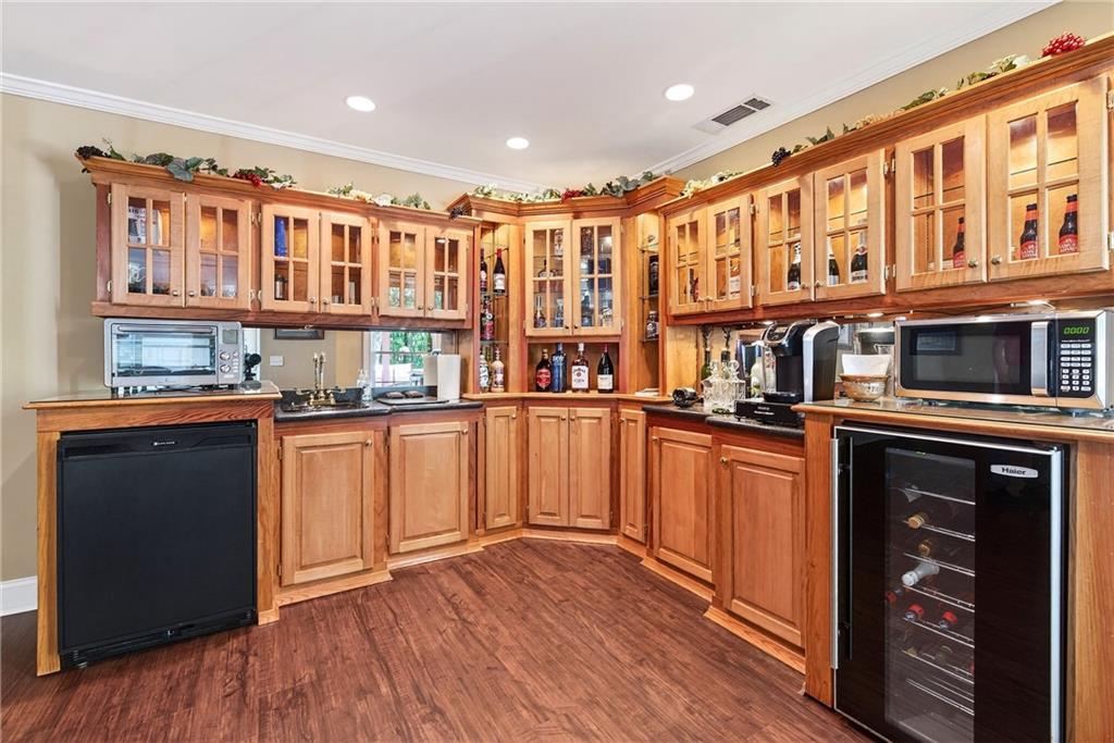 865 Laurel Ridge Road Cleveland, GA 30528 - Photo 54 of 81 a kitchen with stainless steel appliances granite countertop a refrigerator and wooden floor