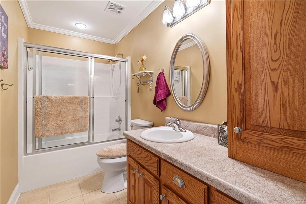 865 Laurel Ridge Road Cleveland, GA 30528 - Photo 56 of 81 a bathroom with a granite countertop sink mirror vanity and toilet